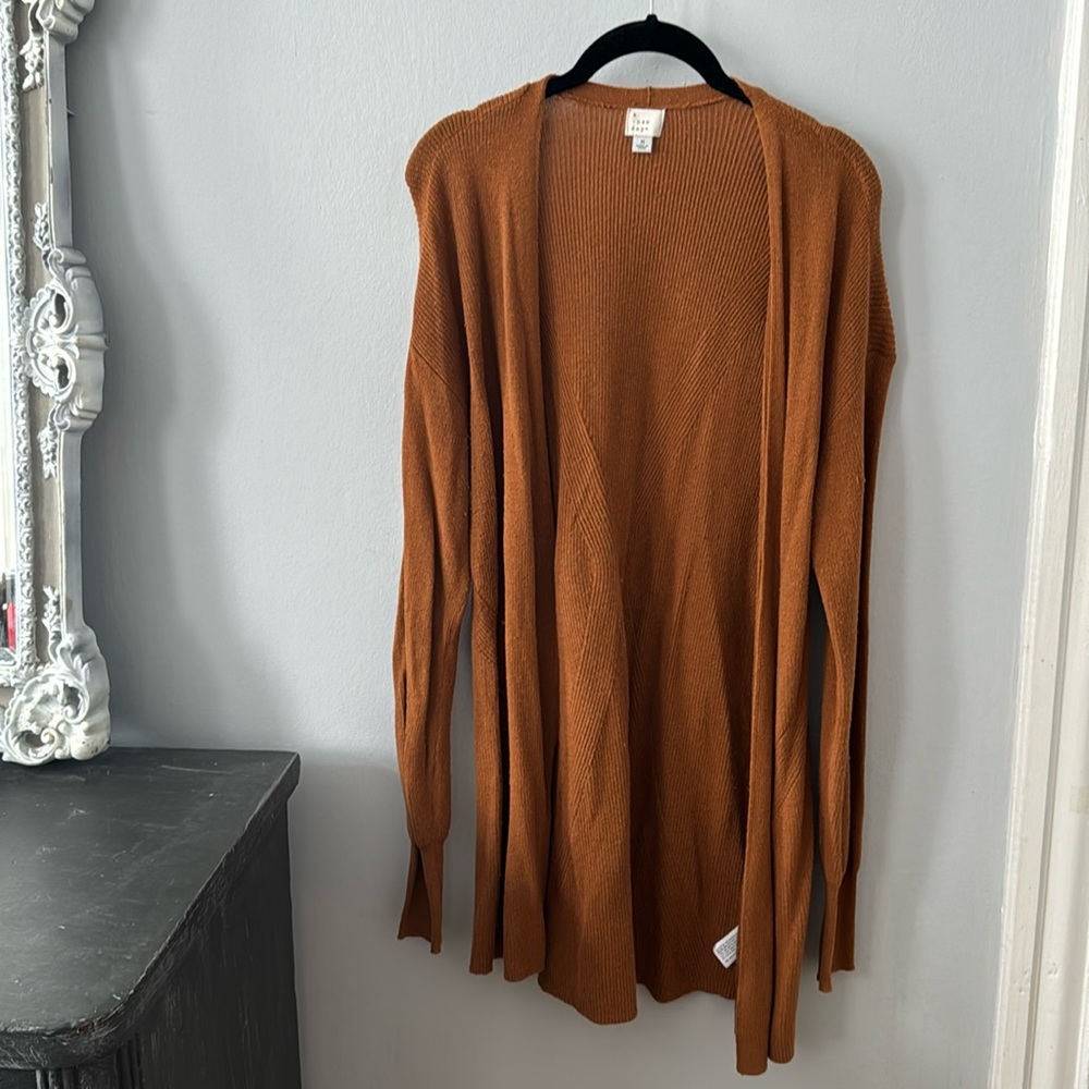 A . New. Day orange cardigan size M